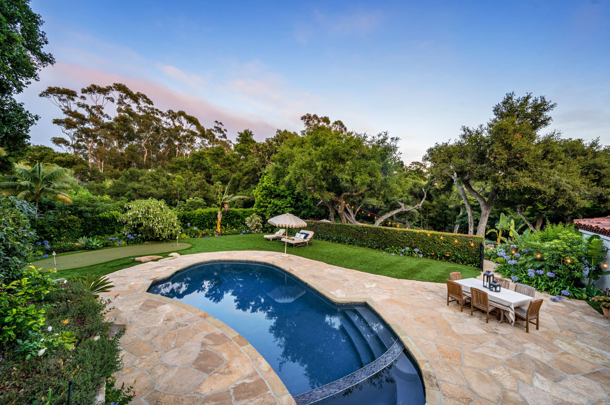 backyard pool putting green brings luxury and fun together